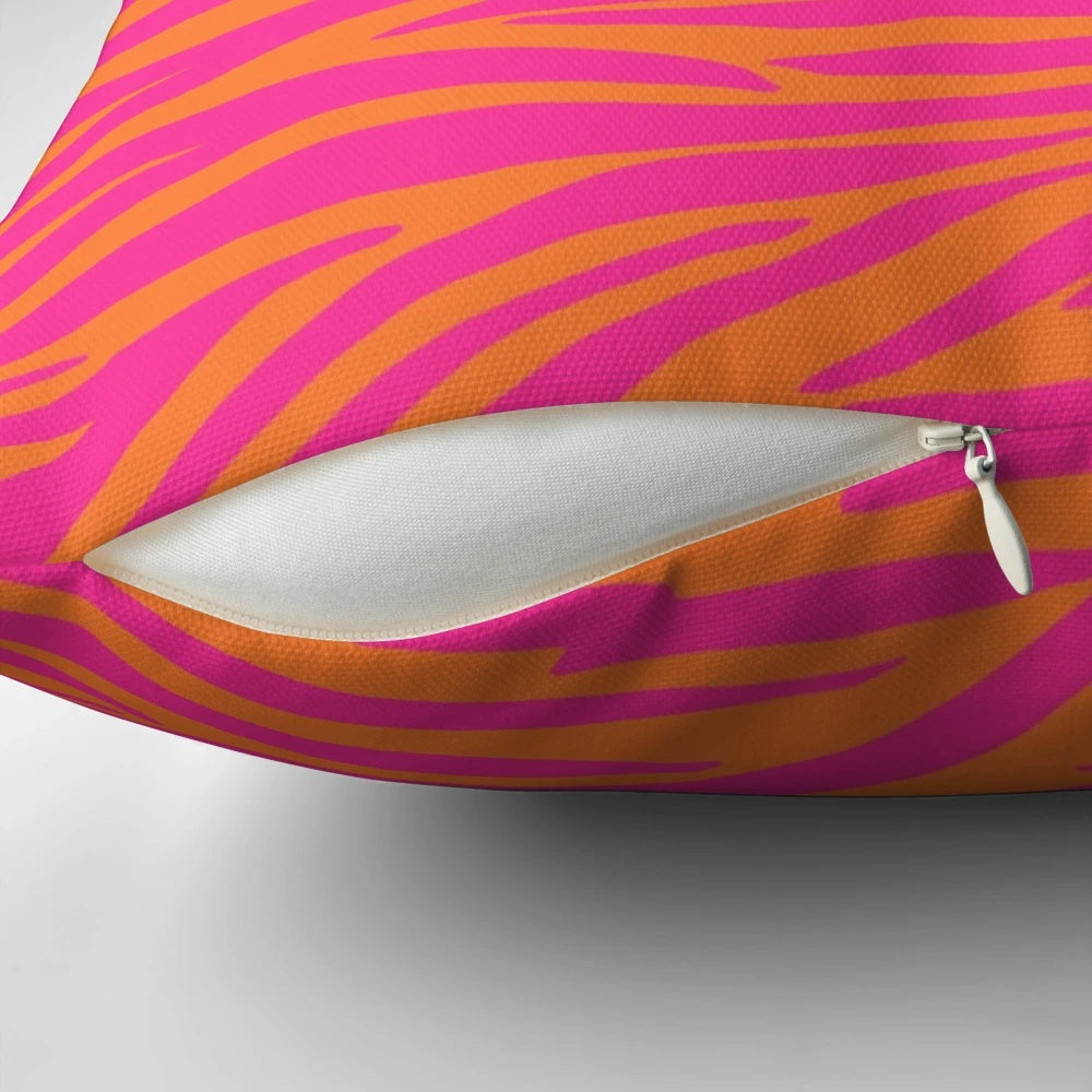 Close-up of a pink and orange zebra-striped decorative pillow