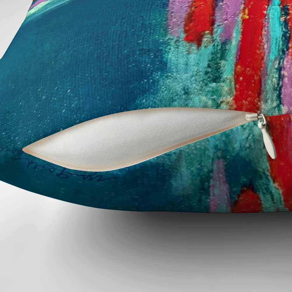 Decorative pillow featuring a textured zia symbol design in a blend of vibrant teal, lavender, and red colors.