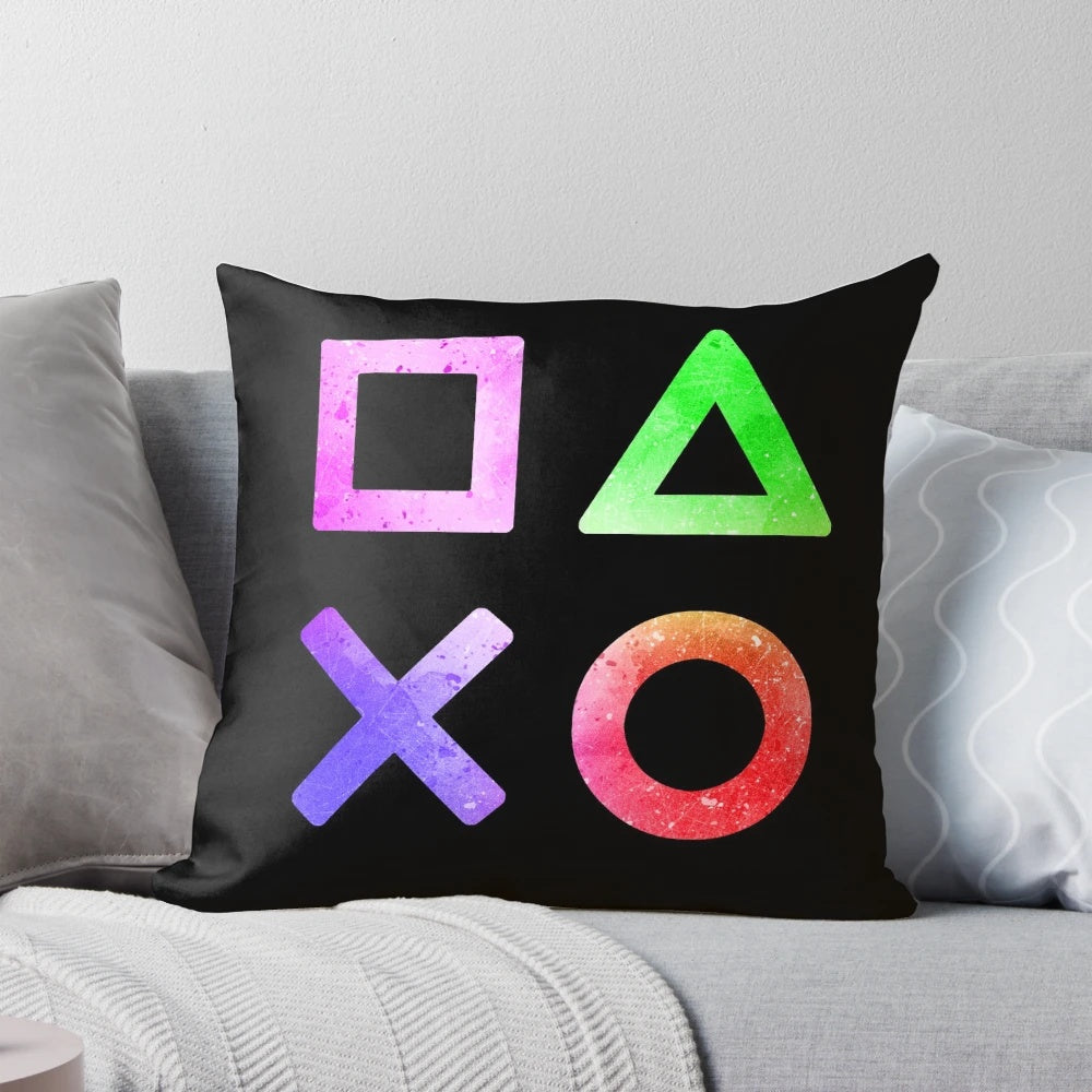 A colorful pillow featuring the iconic buttons and joystick of a video game controller, ideal for gaming enthusiasts.