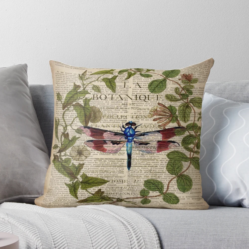 Vintage 1980s dark academia style botanical illustration of a dragonfly printed on a pillow.