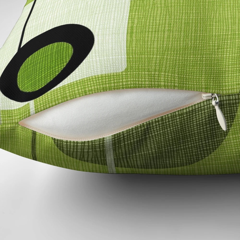 Vintage-inspired abstract throw pillow featuring a green and black orb and square pattern, perfect for modern and mid-century inspired home decor.