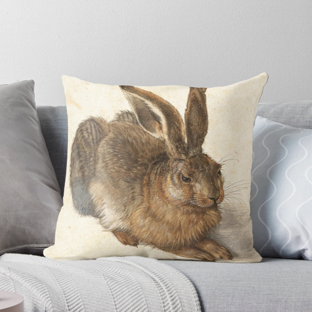 Albrecht Durer Hare Pillow featuring a renaissance era woodcut illustration of a hare