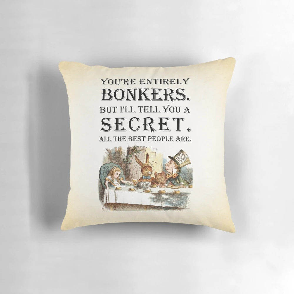 Alice in Wonderland-themed throw pillow with a vintage-inspired quote about being "entirely bonkers