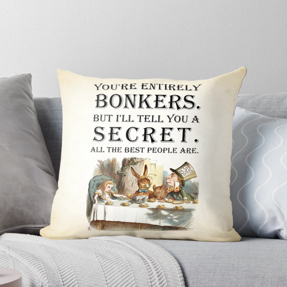 Alice in Wonderland-themed throw pillow with a vintage-inspired quote about being "entirely bonkers