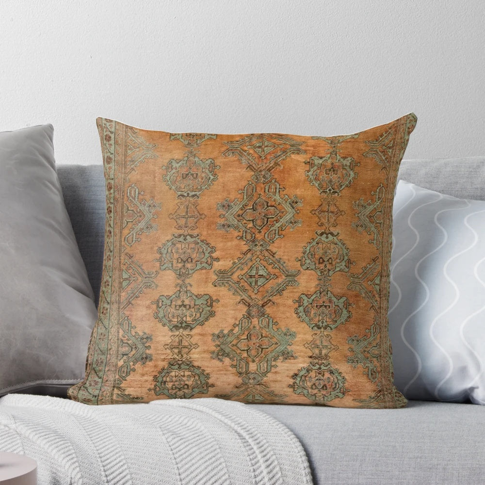 Antique Turkish Oushak rug print pillow with floral and geometric patterns in warm copper and nature-inspired colors.