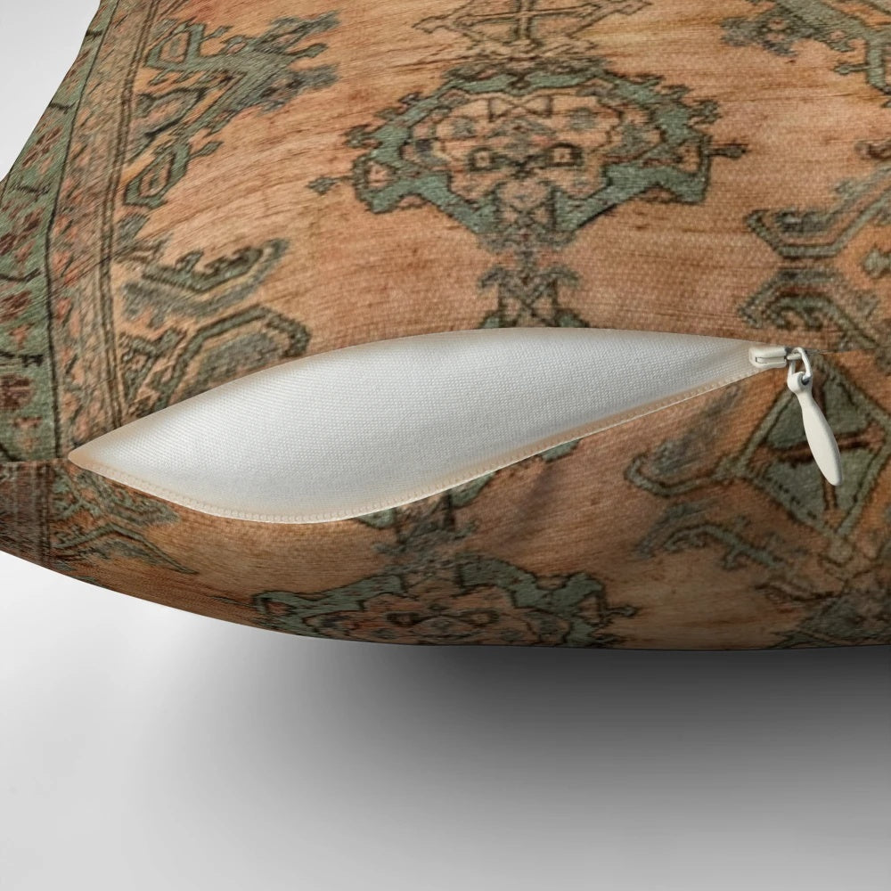 Antique Turkish Oushak rug print pillow with floral and geometric patterns in warm copper and nature-inspired colors.