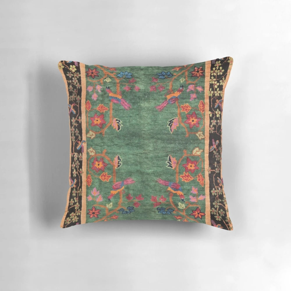 Vintage Art Deco Rug Print Pillow featuring a floral and bird design in emerald green and nature-inspired colors.