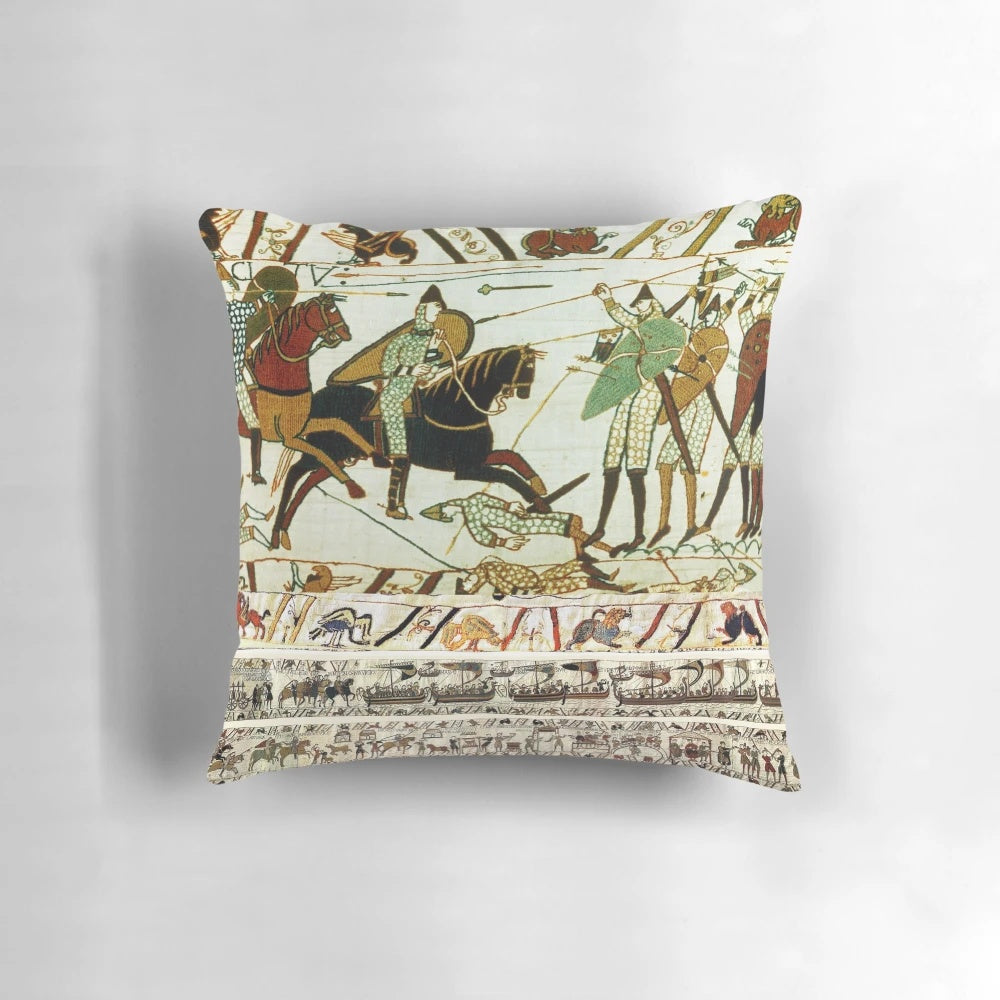 Detailed embroidered pillow depicting the famous Battle of Hastings with Norman knights on horseback.