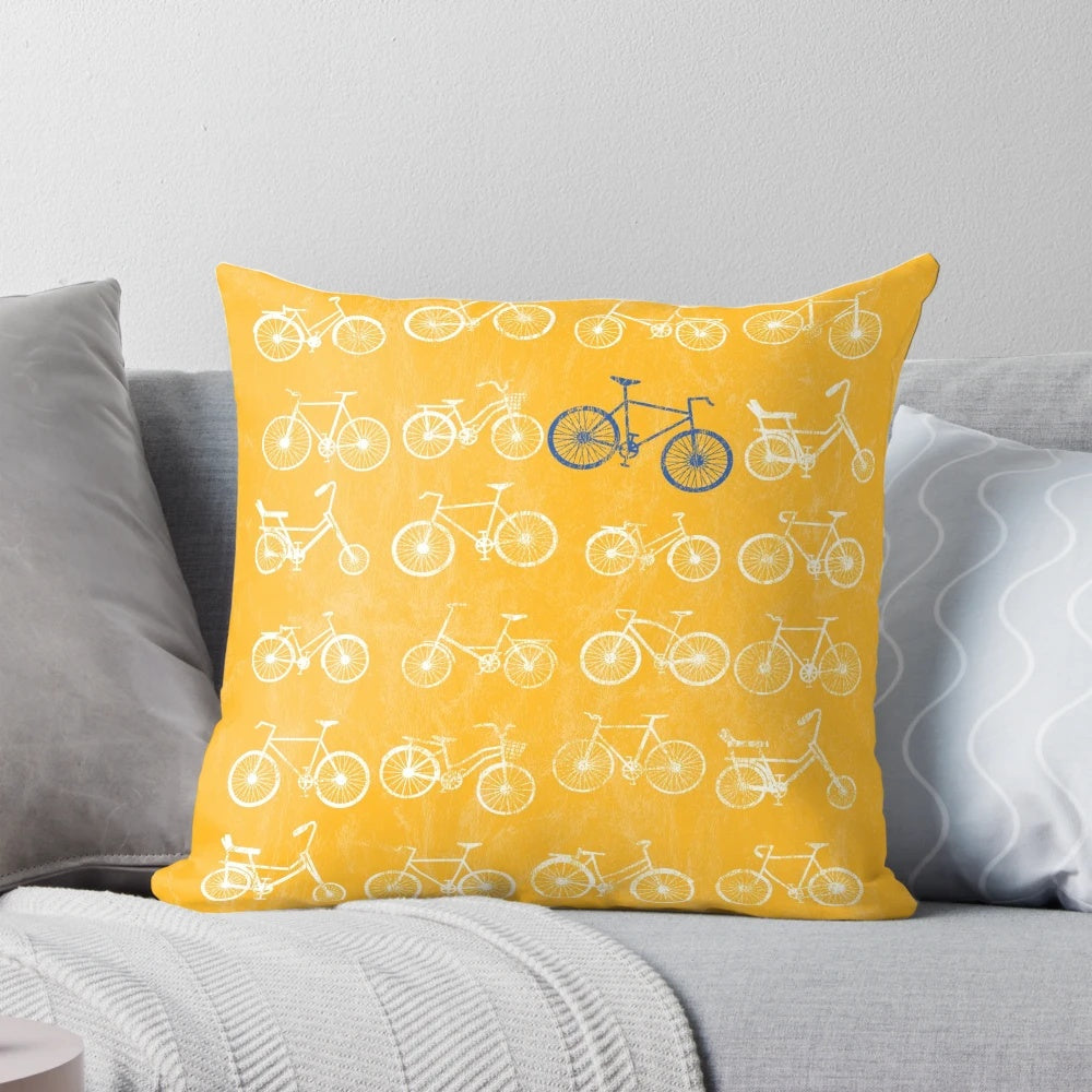 Vintage bicycle art pillow with a distressed, grunge design featuring a blue and white bicycle against a yellow background.