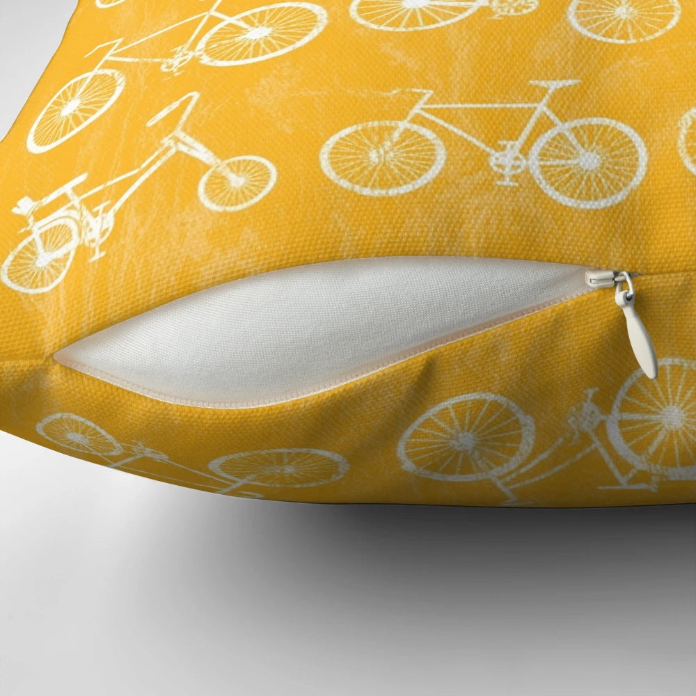 Vintage bicycle art pillow with a distressed, grunge design featuring a blue and white bicycle against a yellow background.