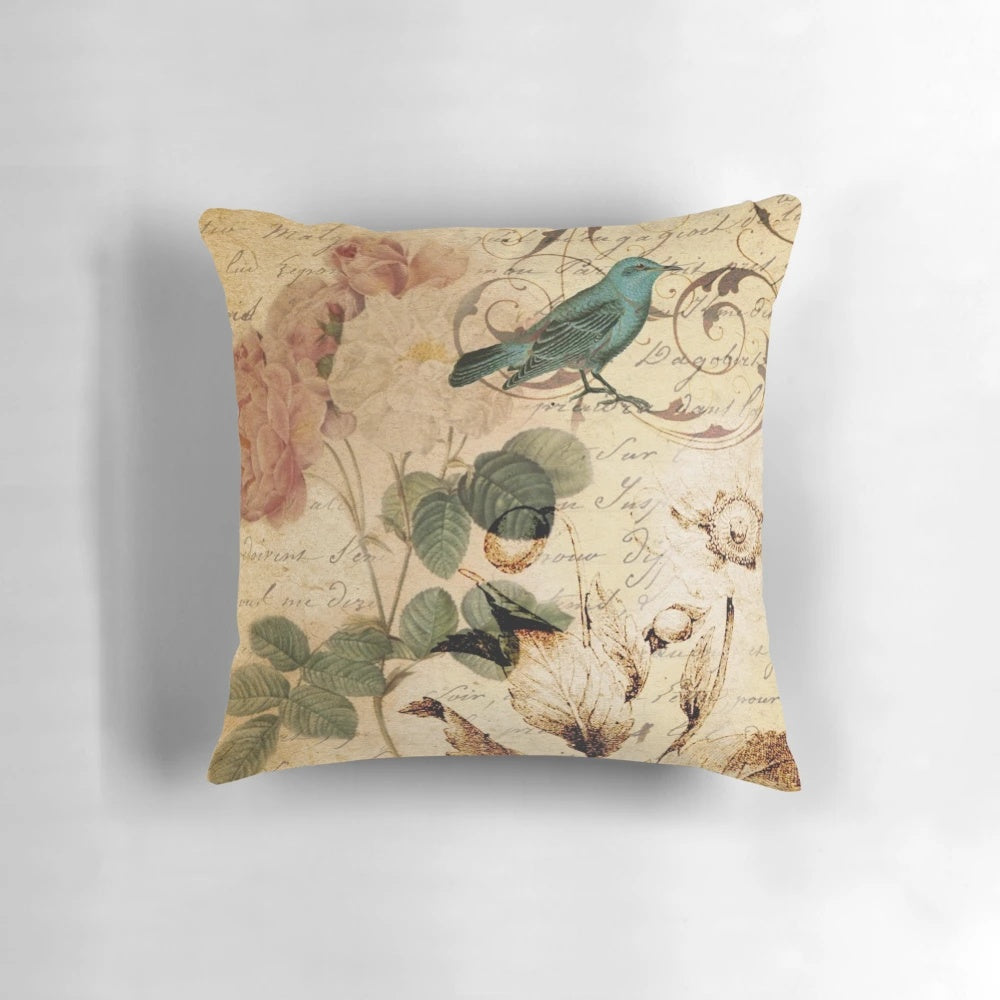 Vintage-inspired pillow featuring a beautiful bird illustration and botanical artwork in a cottagecore style.