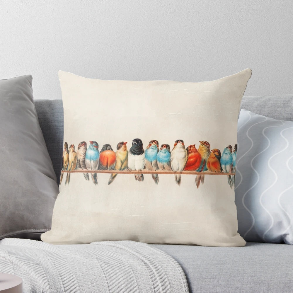 A vintage-inspired throw pillow featuring a beautiful bird design, perfect for adding a touch of rustic charm to any space.