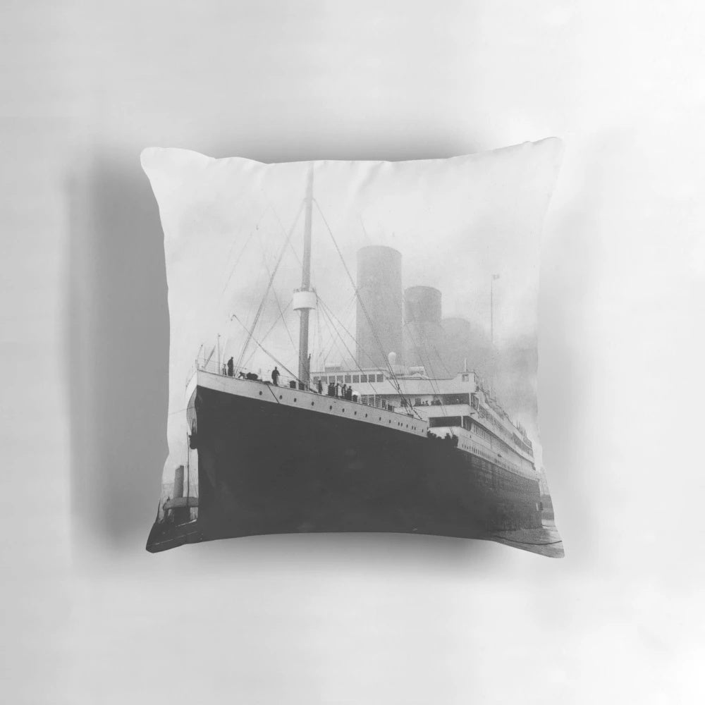 Vintage black and white photograph of the RMS Titanic docked in the harbor of Southampton, UK.