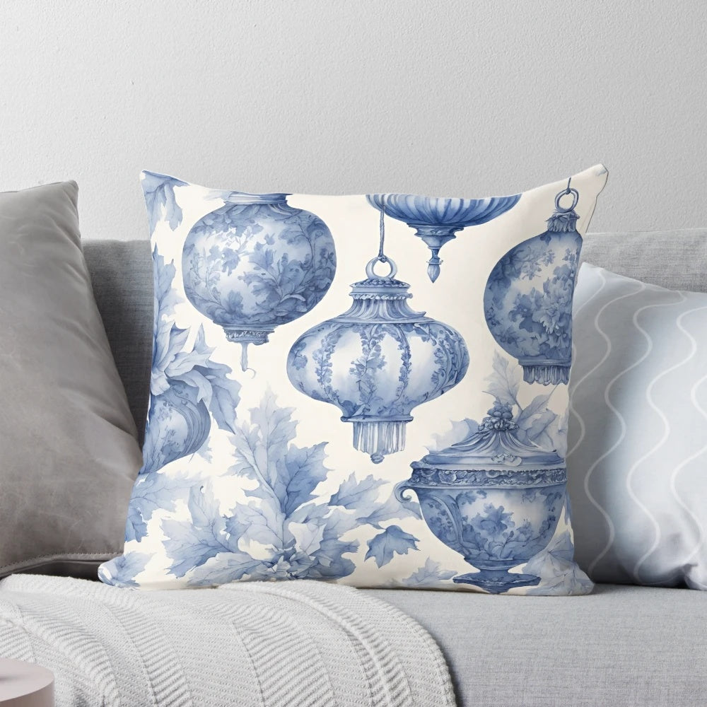 A blue and white vintage-style Toile de Jouy patterned Christmas ornament pillow