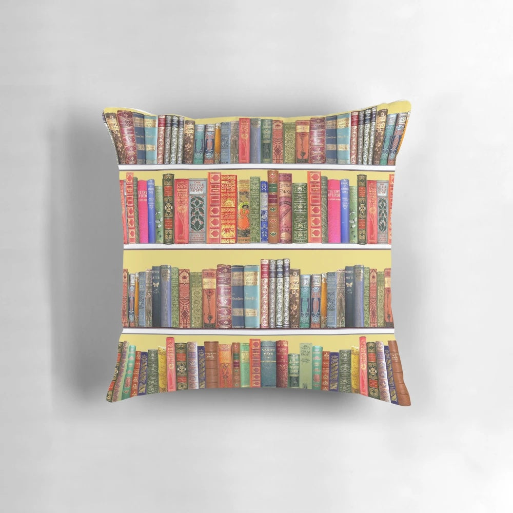 Cozy vintage bookshelf with Christmas books on a yellow pillow