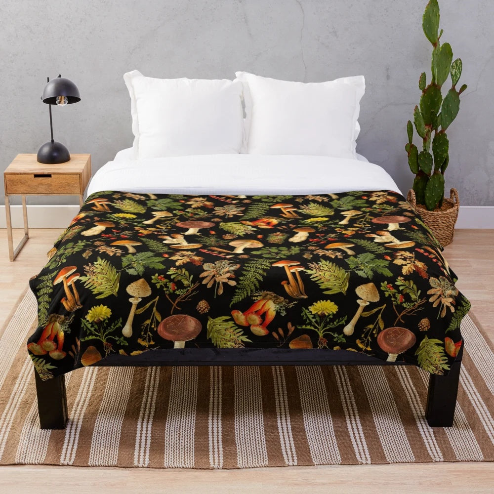 Vintage botanical pattern with psychedelic mushrooms on a black plush blanket