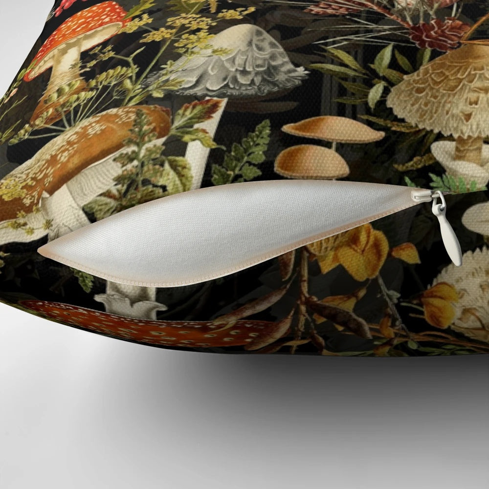 A decorative pillow featuring a vintage botanical pattern of midnight mushrooms in a forest night garden design.