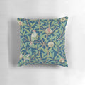 Vintage-style botanical pillow featuring a William Morris-inspired pomegranate and bird design