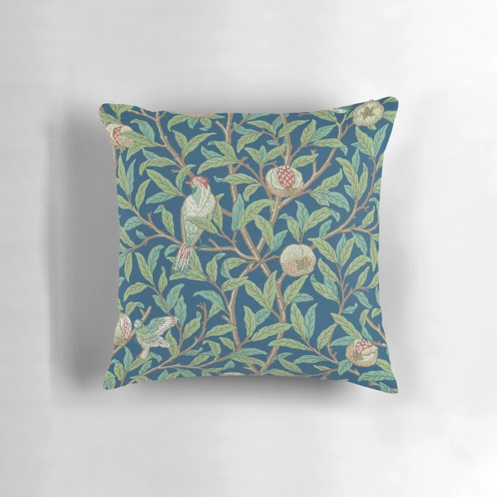 Vintage-style botanical pillow featuring a William Morris-inspired pomegranate and bird design