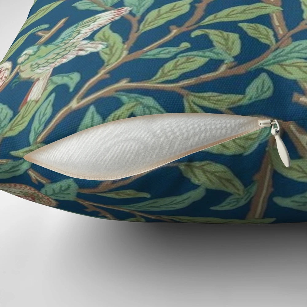 Vintage-style botanical pillow featuring a William Morris-inspired pomegranate and bird design