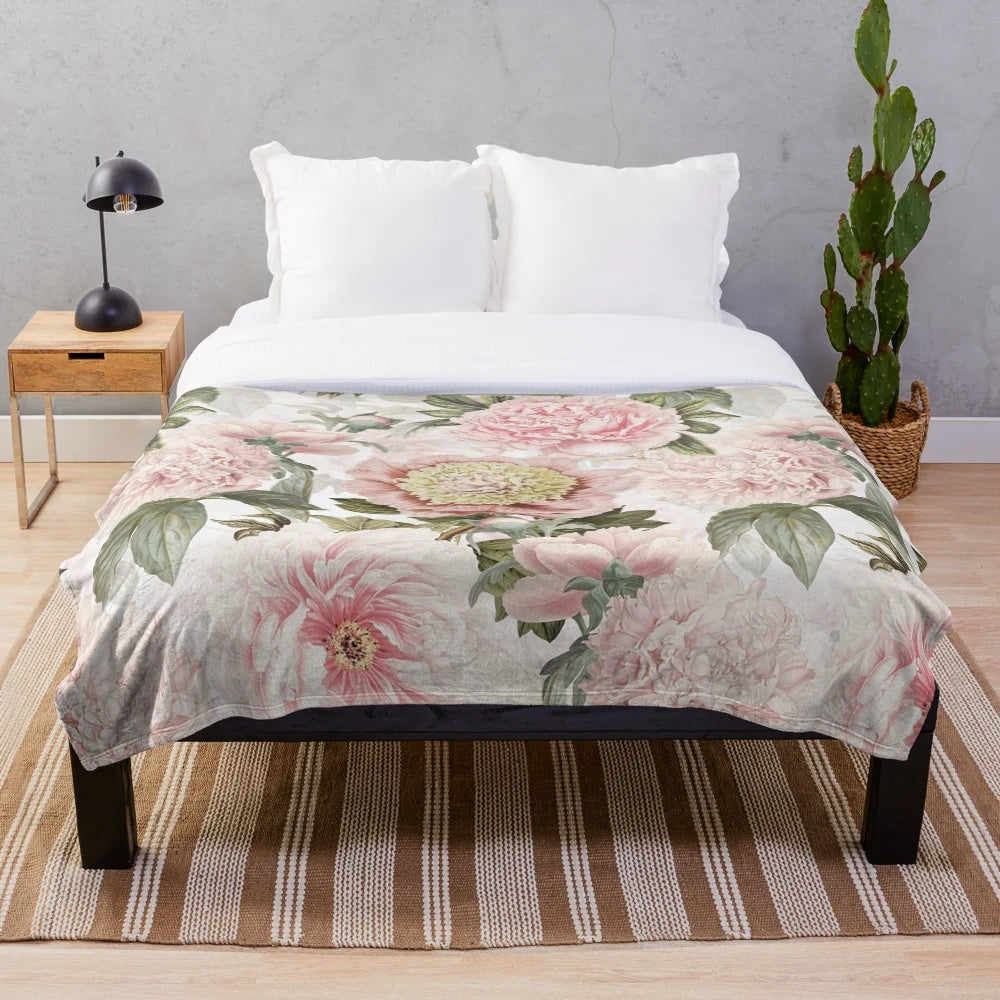 Vintage botanical plush blanket featuring a pattern of blush pink peony flowers
