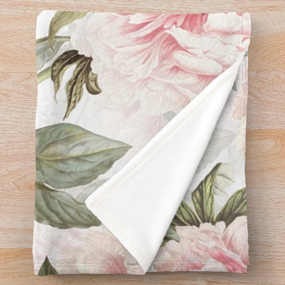 Vintage botanical plush blanket featuring a pattern of blush pink peony flowers