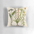 A vintage-inspired botanical study pillow featuring a painterly illustration of flowers including allium, hyacinth, and viola.