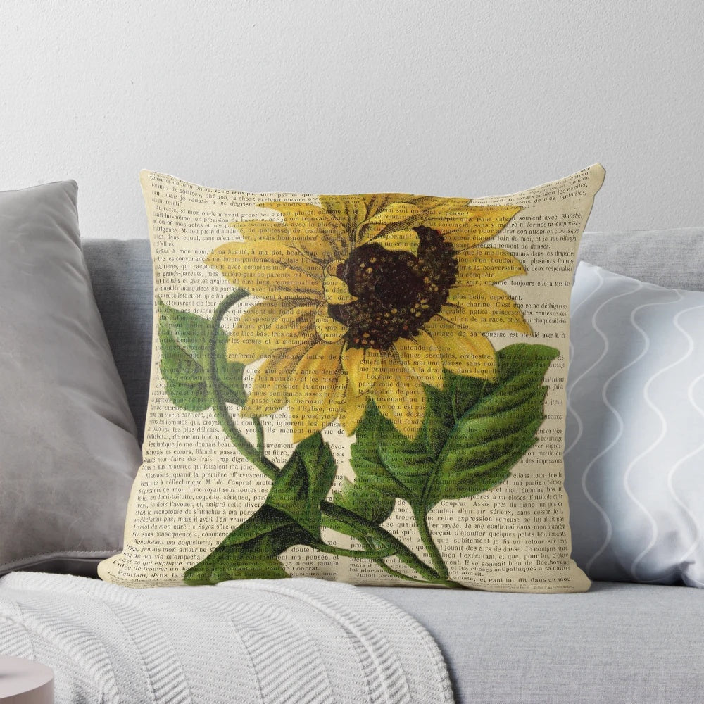 Vintage botanical sunflower print on an aged book page, decorative throw pillow