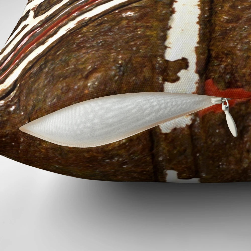 Close-up photography of a weathered and rusted Union Jack flag design on a pillow