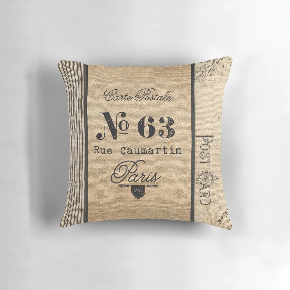 Vintage burlap pillow with antique ticker design, perfect for French-inspired home decor.