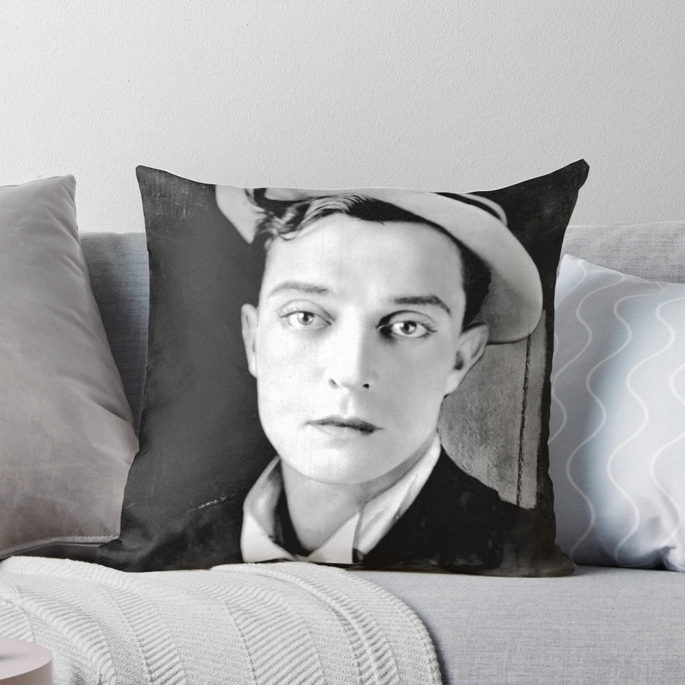 A black and white vintage photograph of the classic actor Buster Keaton printed on a decorative pillow.