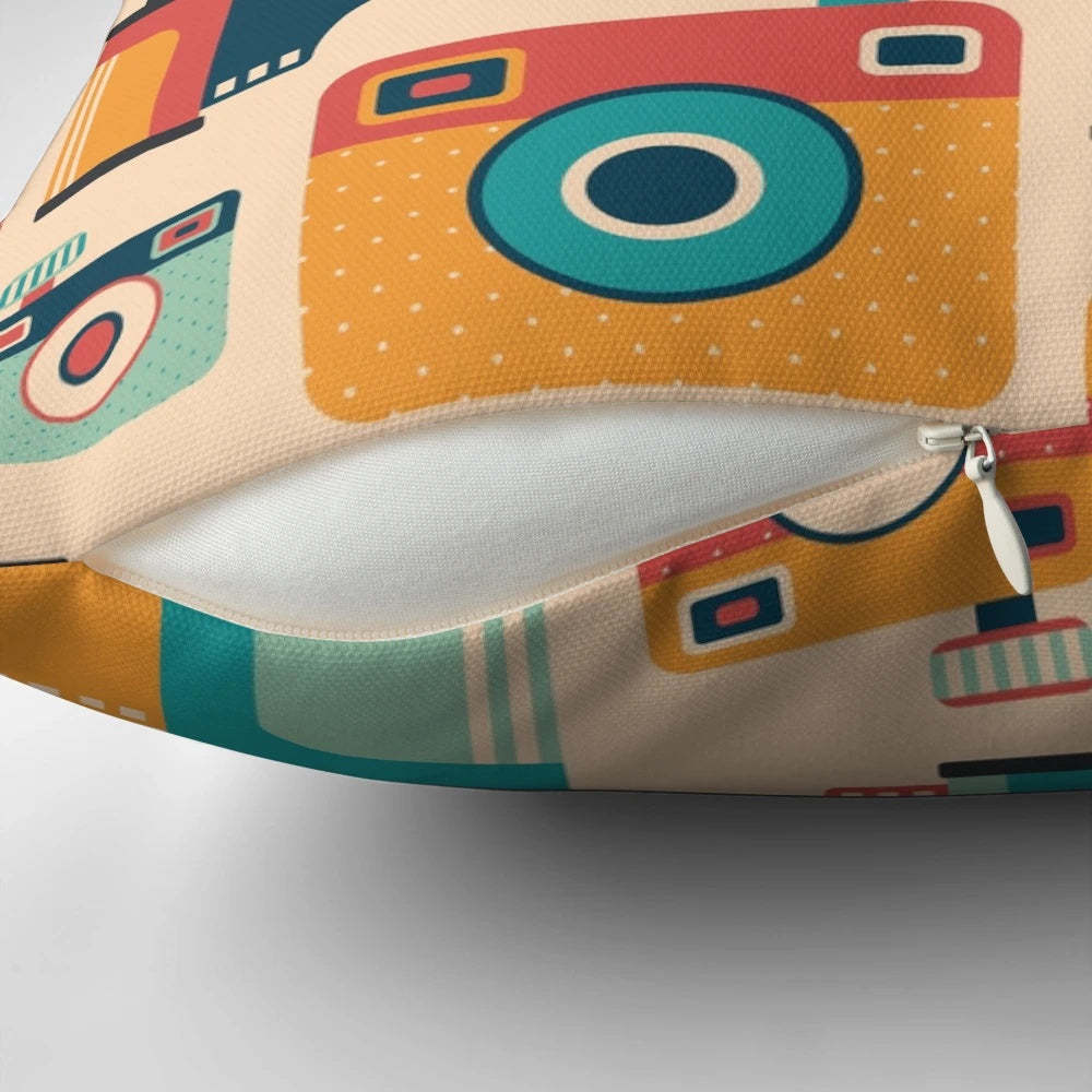 Throw pillow with a vintage camera and film roll graphic design, perfect for home decor and photography enthusiasts.