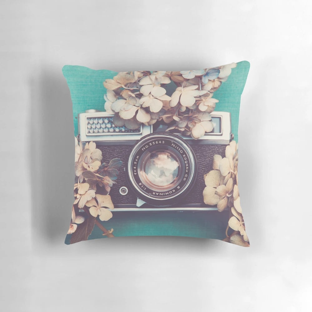Vintage camera and hydrangea flowers printed on a soft, decorative pillow