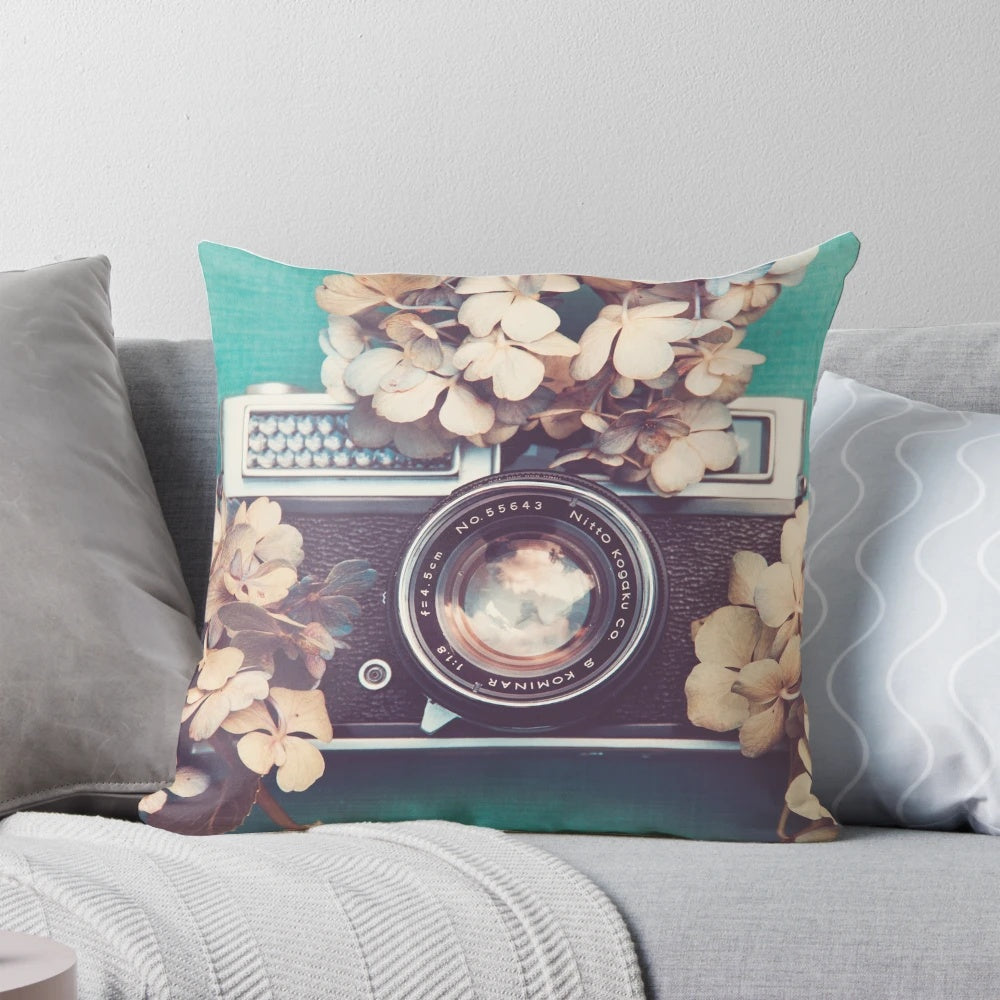 Vintage camera and hydrangea flowers printed on a soft, decorative pillow