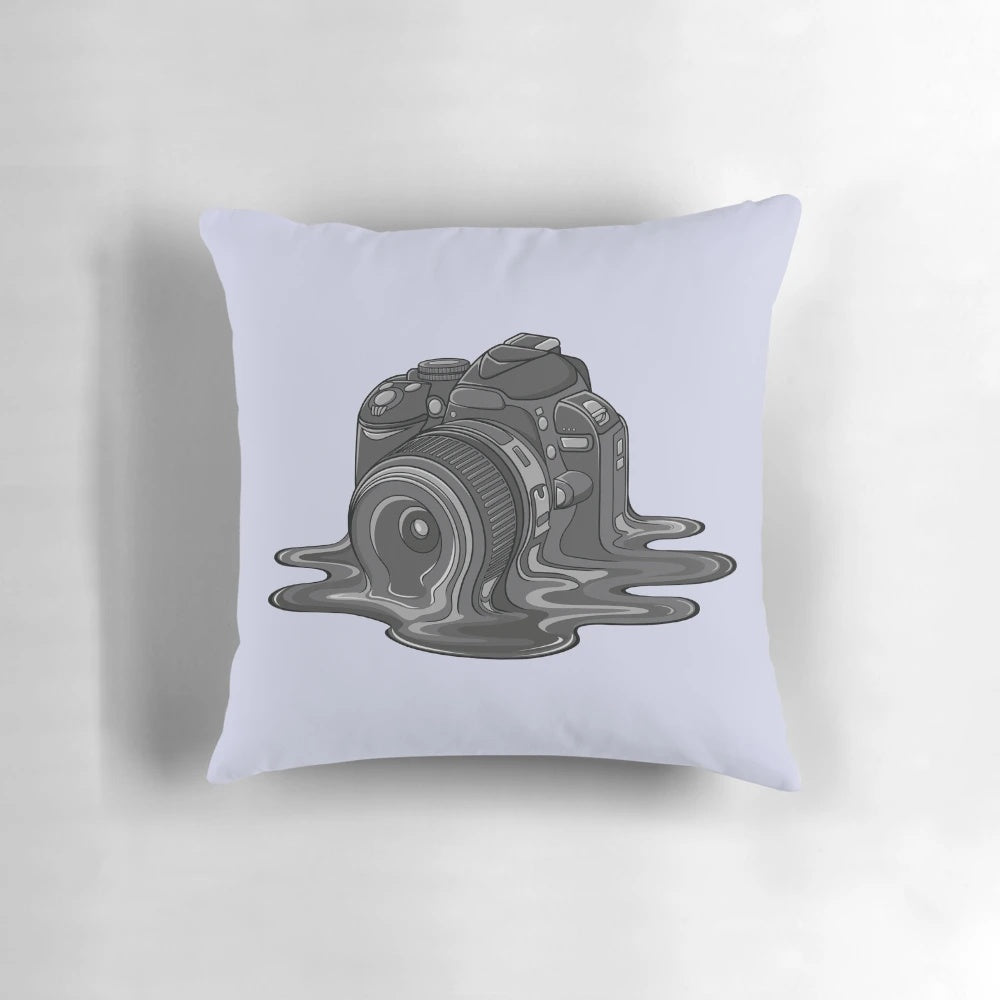 A whimsical, melting camera-themed pillow for photography lovers and home decor enthusiasts.