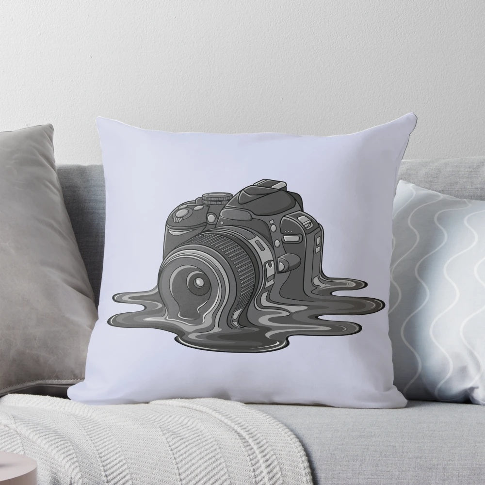 A whimsical, melting camera-themed pillow for photography lovers and home decor enthusiasts.