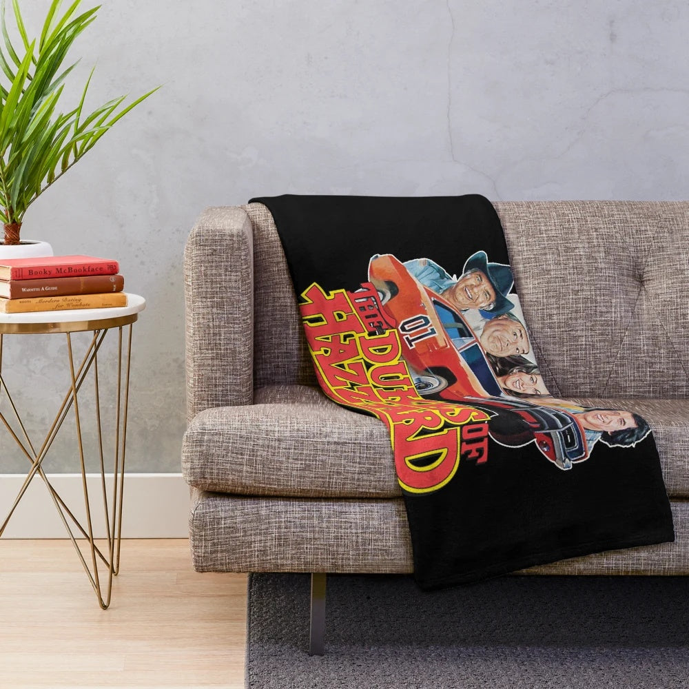 Plush blanket featuring a vintage muscle car and classic rock design