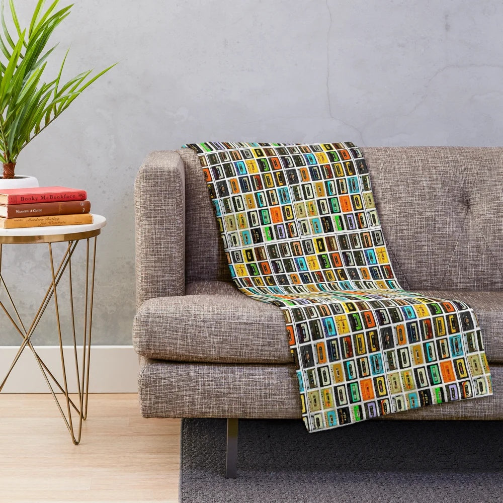 Plush blanket featuring a montage of 1980's cassette tapes and audio equipment