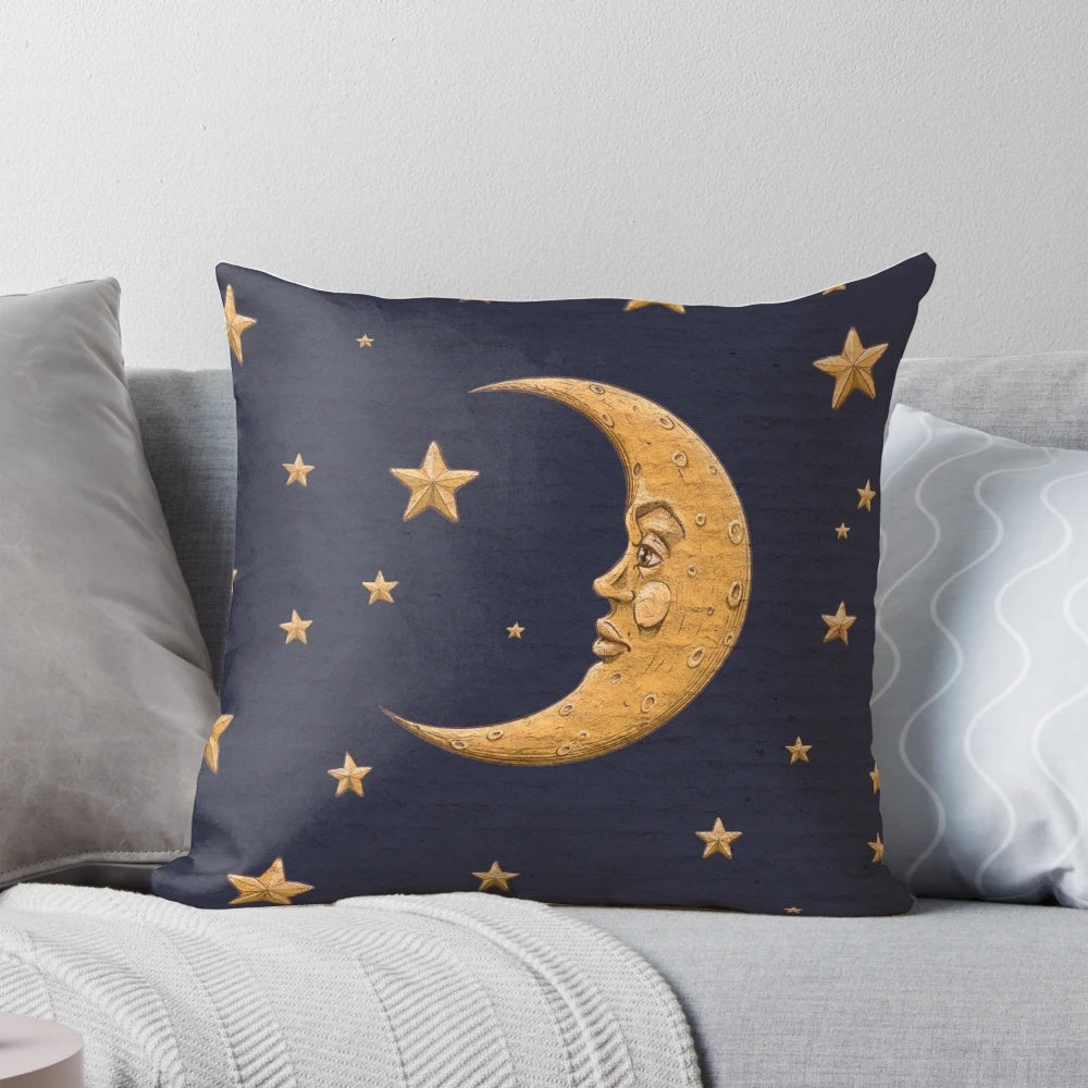 Vintage-style blue throw pillow with golden moon and stars design