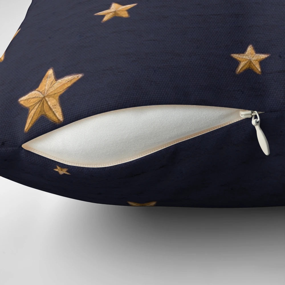 Vintage-style blue throw pillow with golden moon and stars design