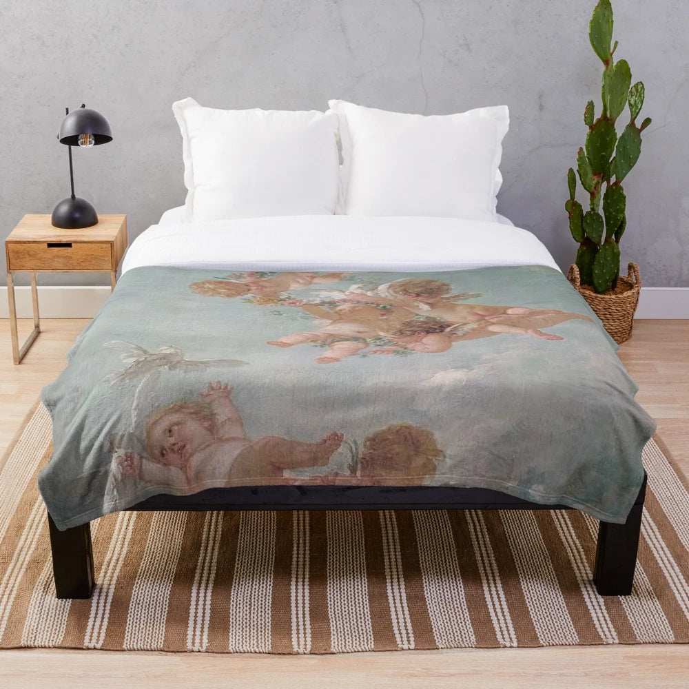 Vintage-inspired plush blanket with cherub and renaissance cloud design