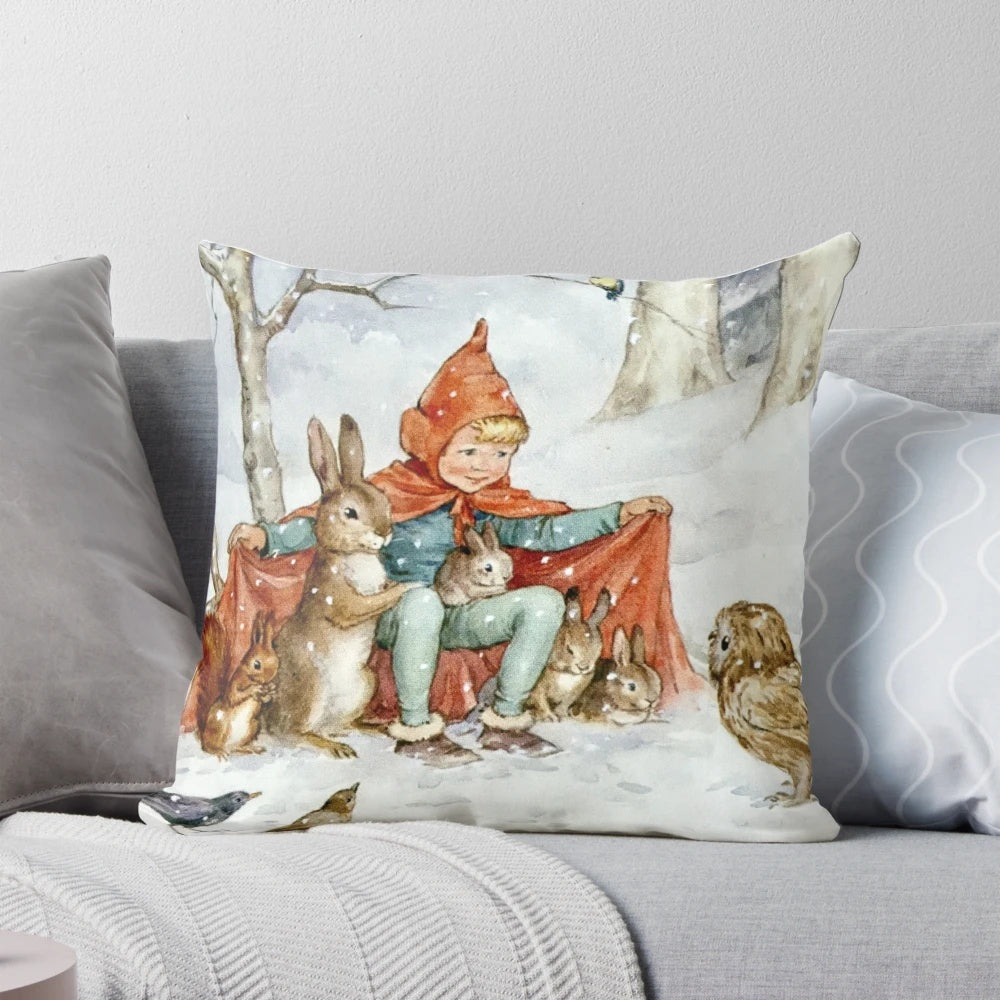 Vintage-style pillow featuring a cozy winter scene with woodland animals in a snowy forest, illustrated by renowned artist Margaret Tarrant.