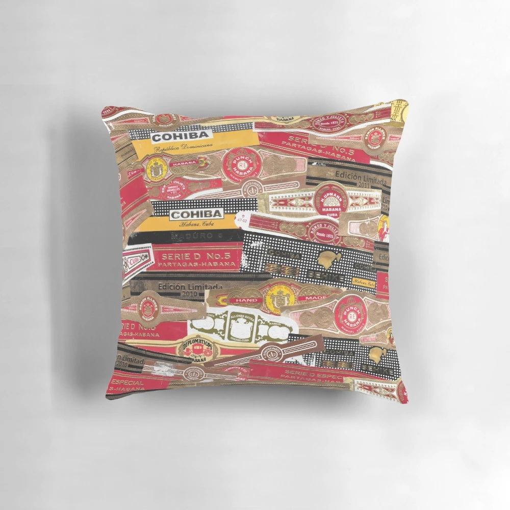Vintage cigar bands artfully arranged on a plush pillow, creating a sophisticated tobacco-inspired home accent.