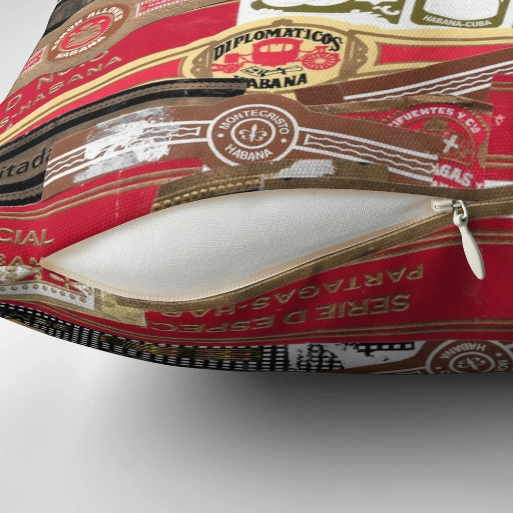Vintage cigar bands artfully arranged on a plush pillow, creating a sophisticated tobacco-inspired home accent.