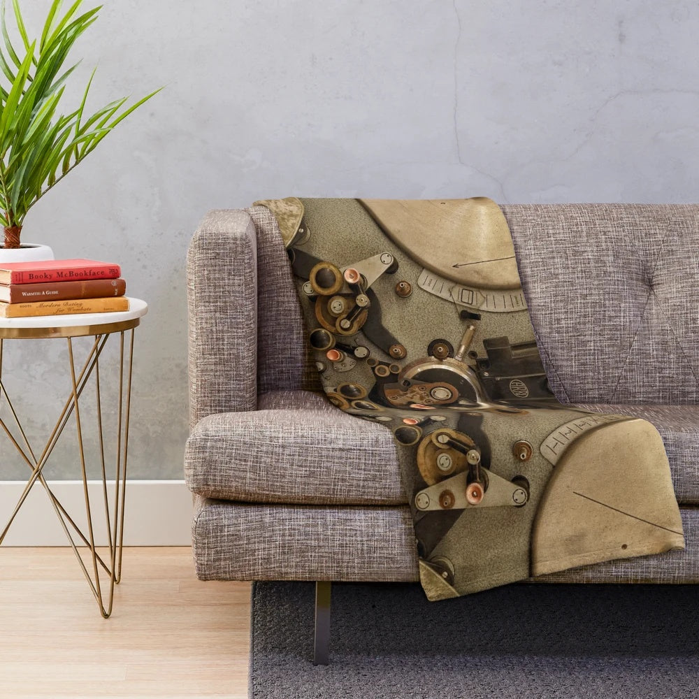 Vintage cinema-themed plush blanket with old camera and film reel design