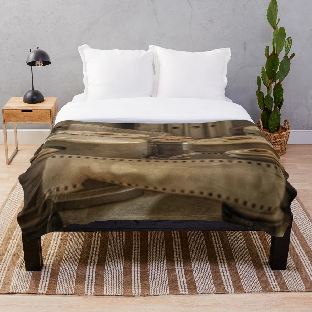 Vintage cinema-themed plush blanket featuring old camera, movie projector, and Ouarzazate landscape