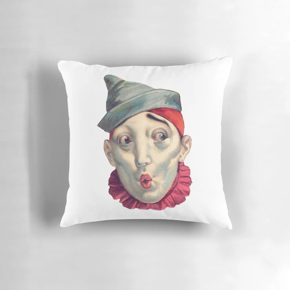 Vintage clown throw pillow with red ruffles, featuring a classic white face clown design inspired by European circus art.