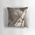 A surreal, dreamlike collage design featuring vintage elements and cosmic imagery on a throw pillow.