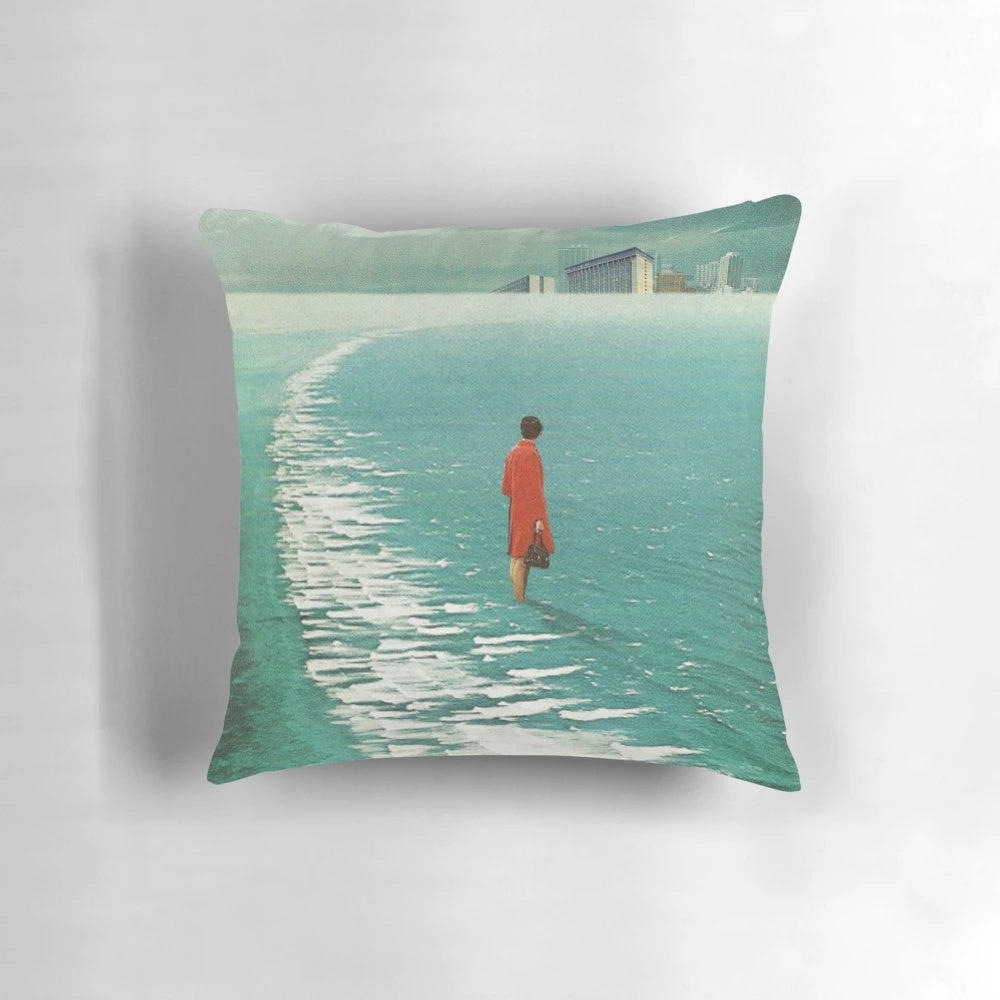 Vintage collage style pillow with a futuristic city landscape fading into the sea