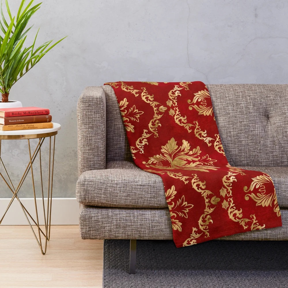 Vintage damask patterned plush blanket in red and gold colors